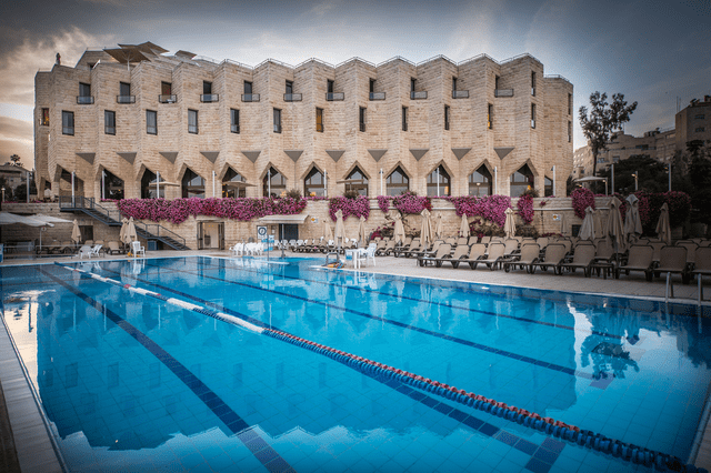 Outdoor pool at The Inbal Hotel